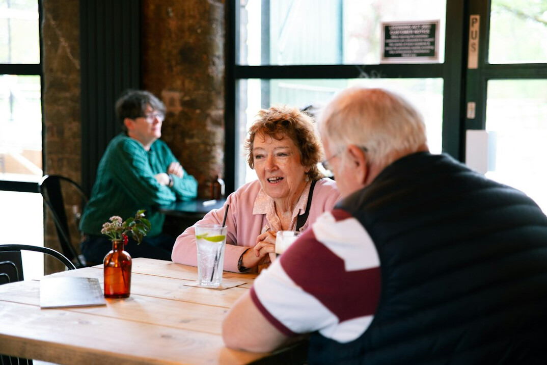 senior friends laughing together